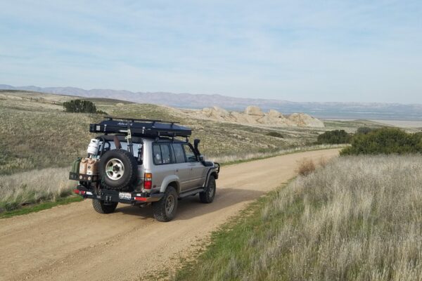 Toyota Landcruiser driving down a dirt road in Carrizo Plain National Monument