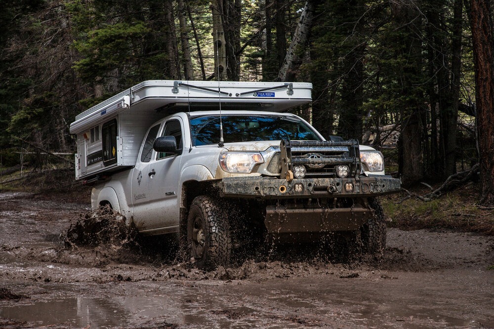  Our Tacoma and Four Wheel Camper getting its feet muddy, Routt National Forest, Colorado | Roseann and Jonathan Hanson /  ExploringOverland.com  