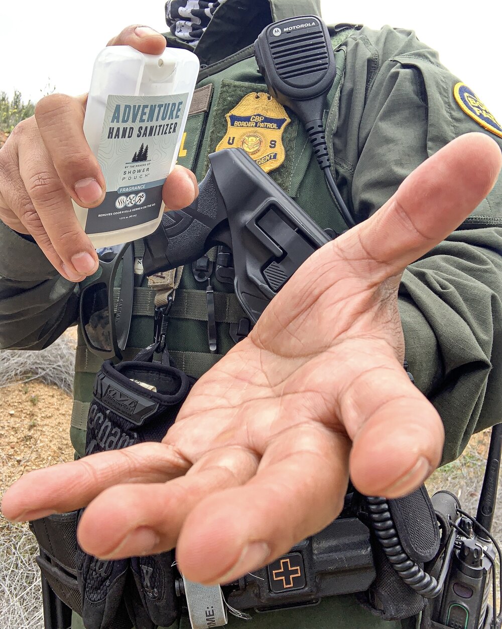 CBP Agent using Showerpouch Hand Sanitizer