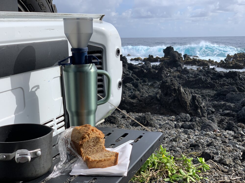 Brewing coffee while enjoying Aunty Sandy’s steaming hot banana bread at K’anae Point