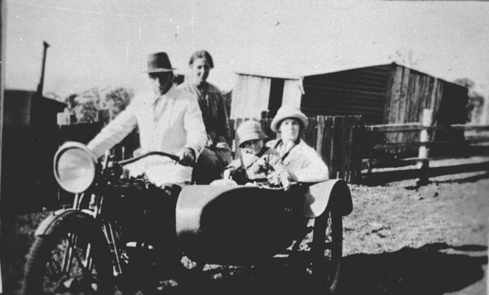 StateLibQld_1_161128_Four_people_on_a_motorcycle_with_sidecar,_ca._1915.jpg