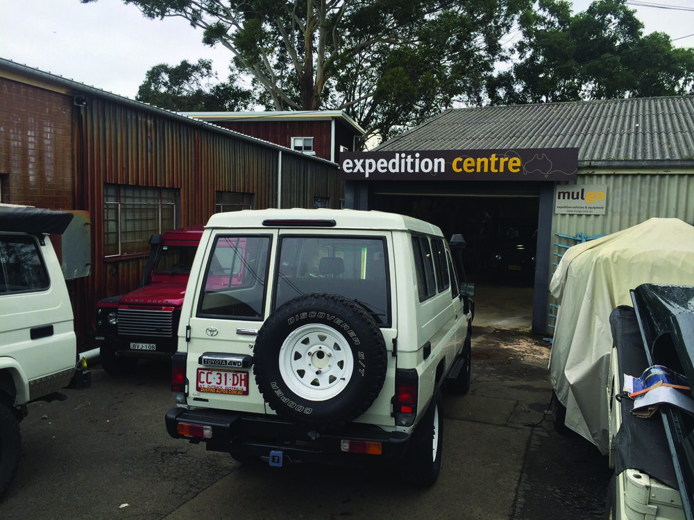 Our Land Cruiser Troop Carrier, still sight unseen, having its roof cut off for the pop-top conversion. | Jonathan Hanson