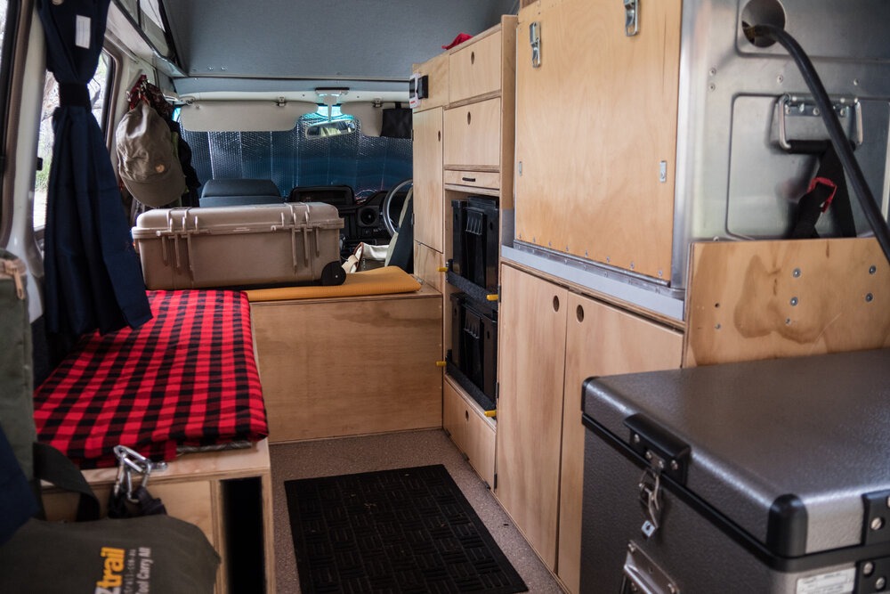  The installed cabinets and bench. The National Luna fridge is at the lower right; above it is the Kanz Kitchen chuck box. | Photo: Jonathan and Roseann Hanson 