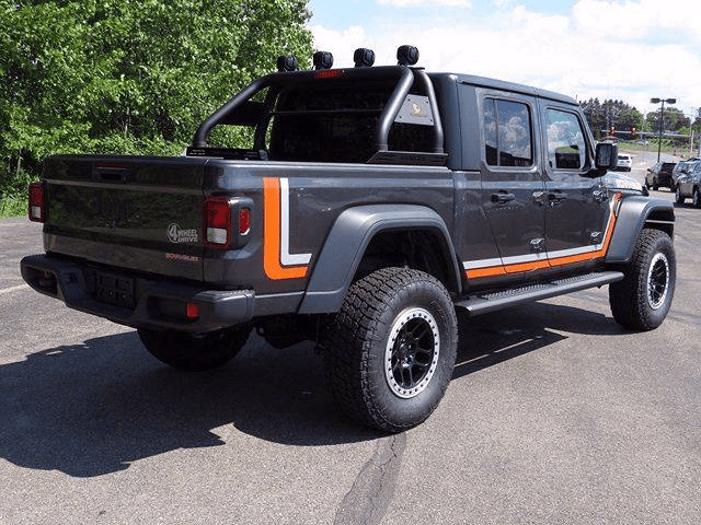 Jeep Gladiator with orange and white side stripes. 