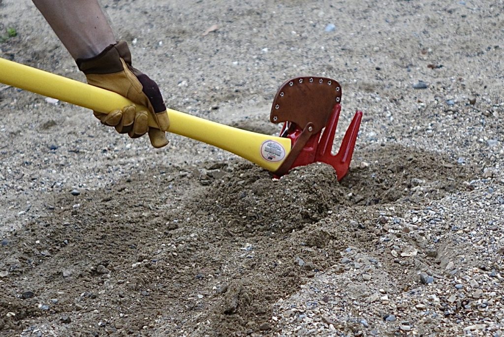 Leveling out sanding soil with McCleod rake.