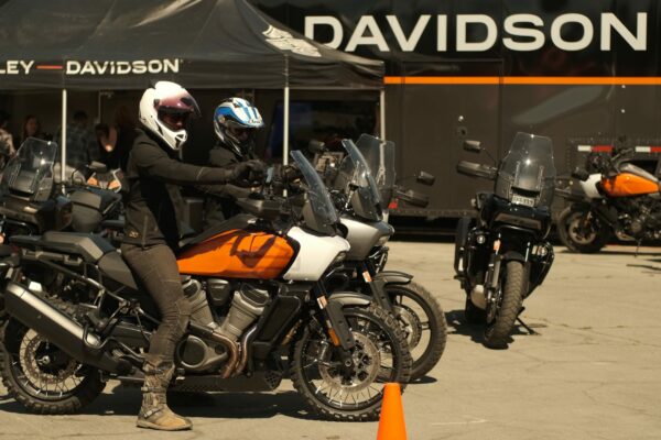 Two women ride adventure motorcycles at Overland Expo