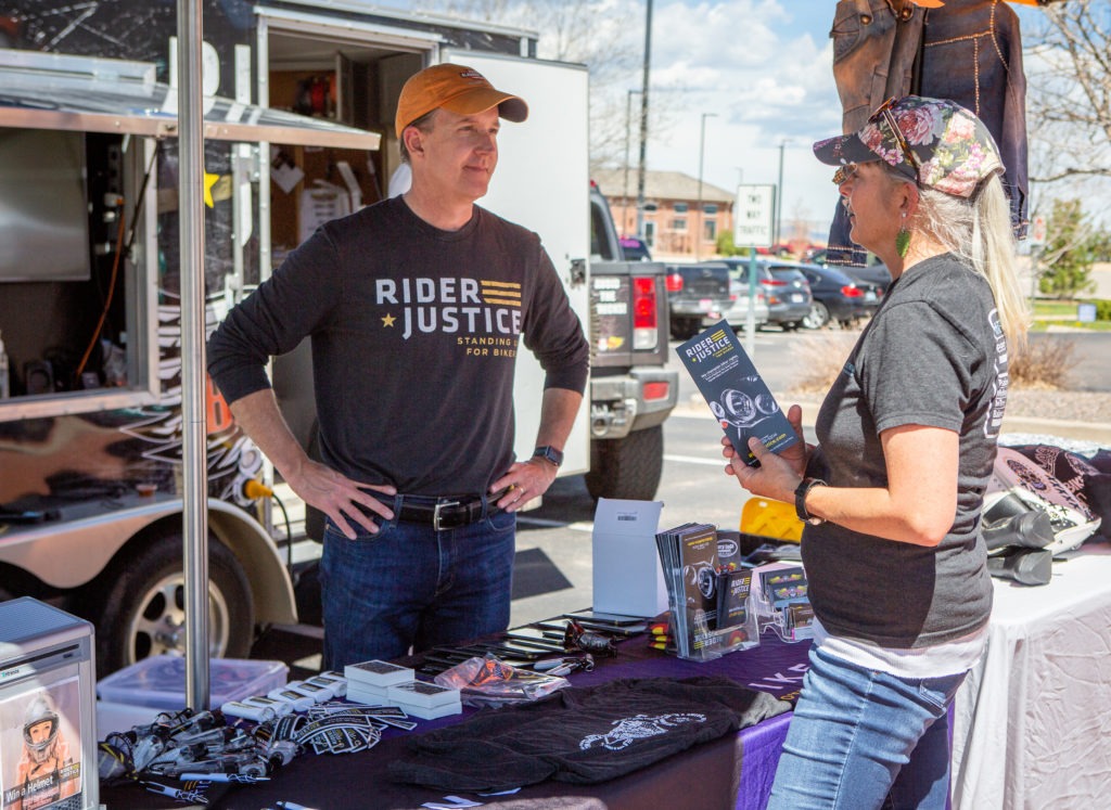 Scott from Rider Justice talks to an interested woman motorcyclist