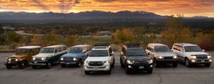Classic Land Cruisers parked together showing the heritage of the vehicle model throughout the years.
