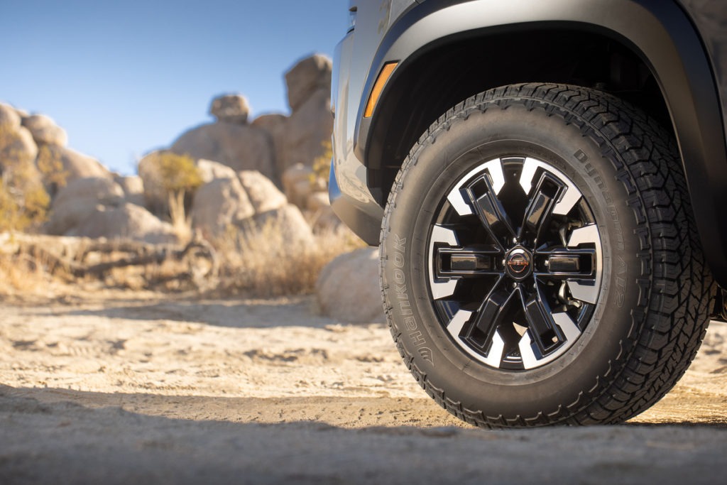 Nissan Frontier tire and wheel close up.