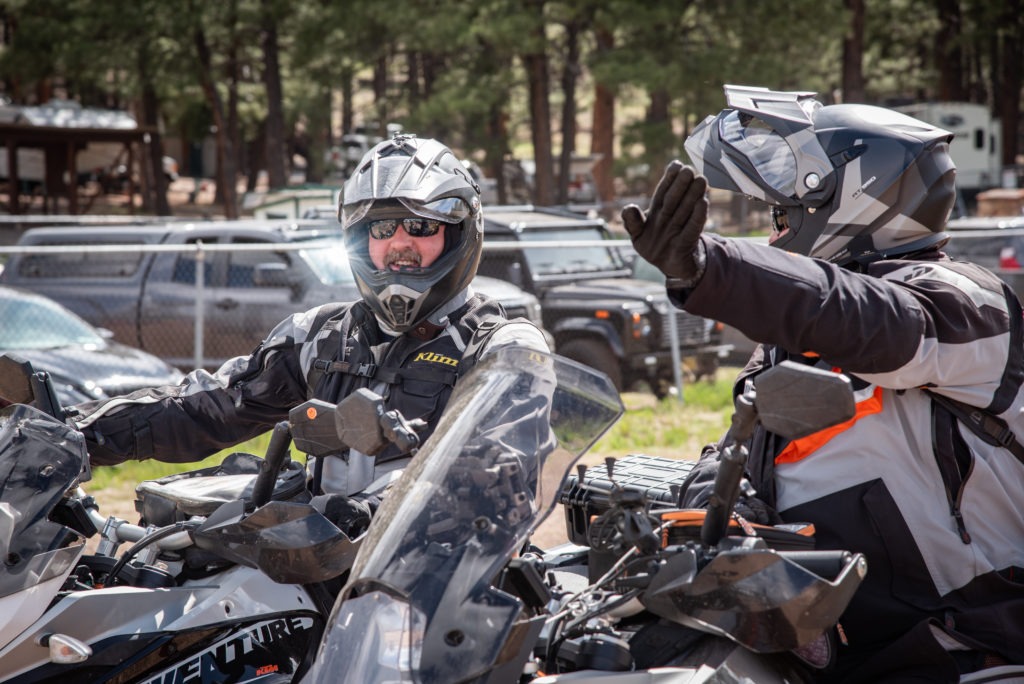 Two riders talk about how to navigate a motorcycle obstacle 