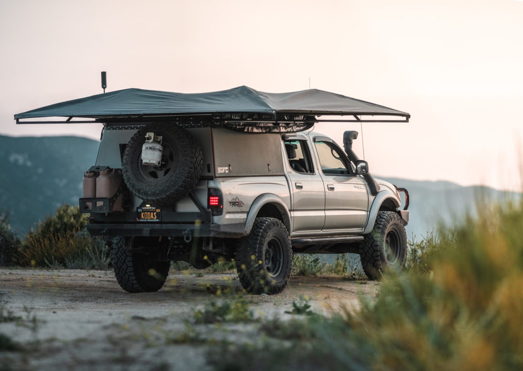 Tacoma with a camper and awning. 