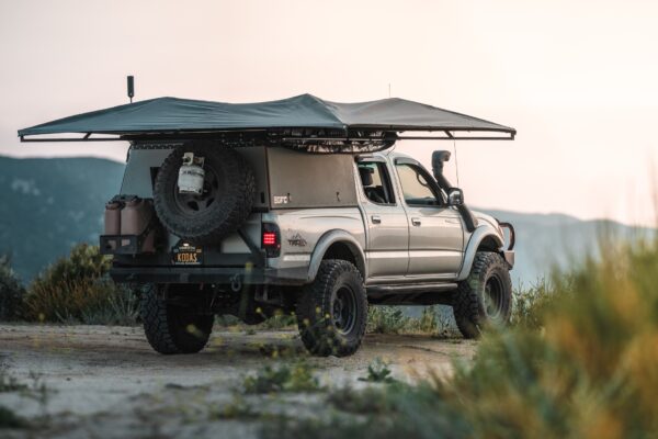 Tacoma with a camper and awning.