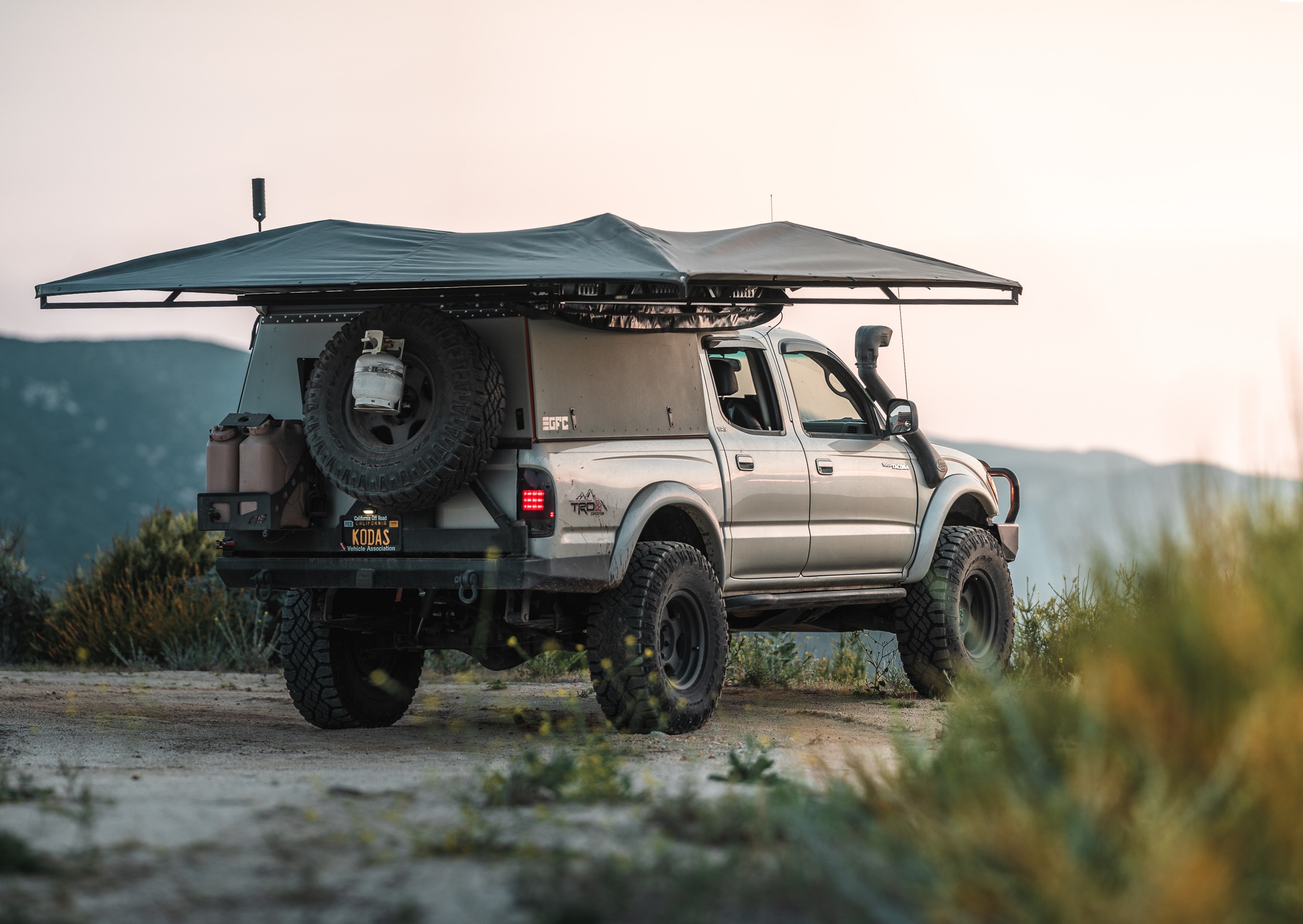 Tacoma with a camper and awning.