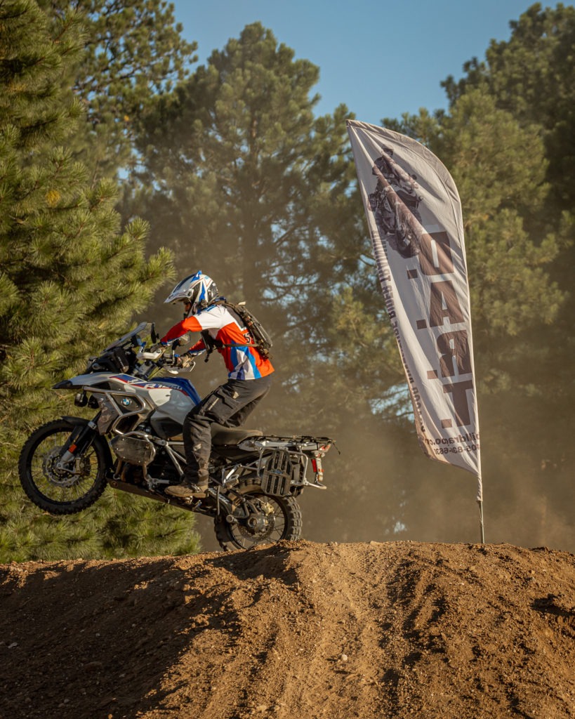 Man on a motorcycle at a weekend training.