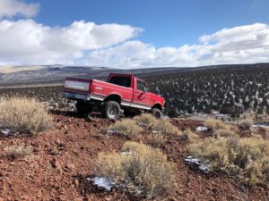 Truck navigating Cinder Butte Viewpoint trail near Bend Oregon.