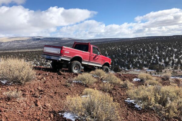 Truck navigating Cinder Butte Viewpoint trail near Bend Oregon.