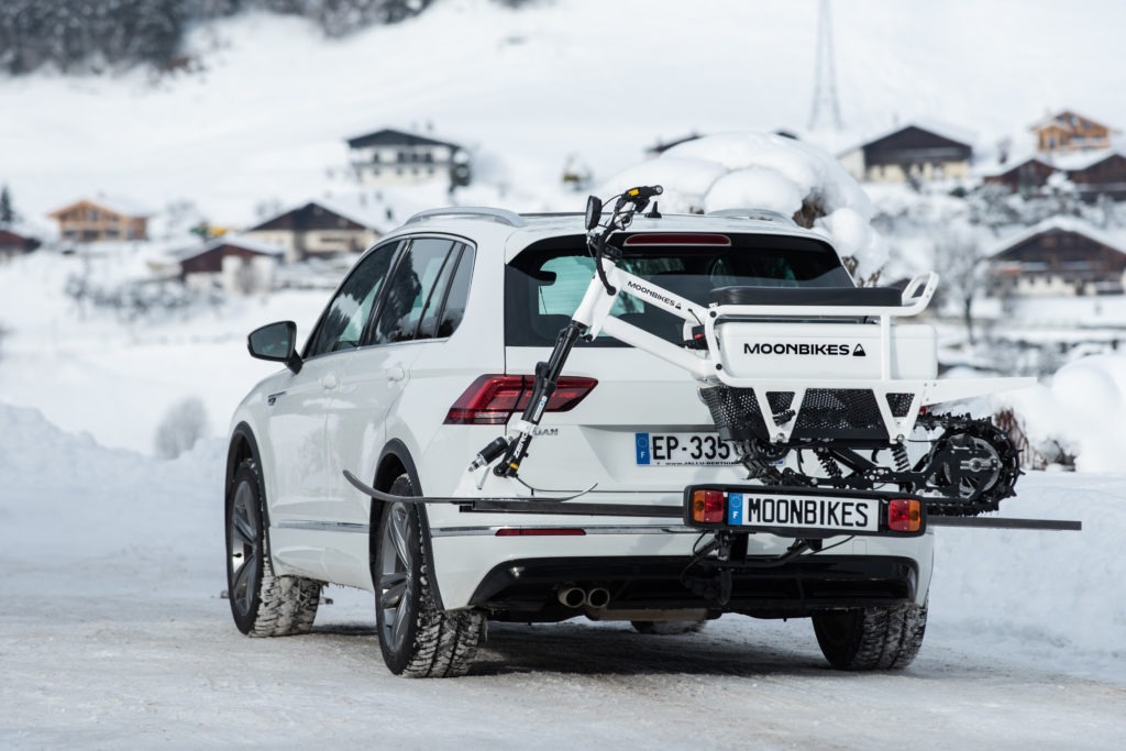 MoonBikes All Electric Adventure Snow Motorcycle on the back of a car