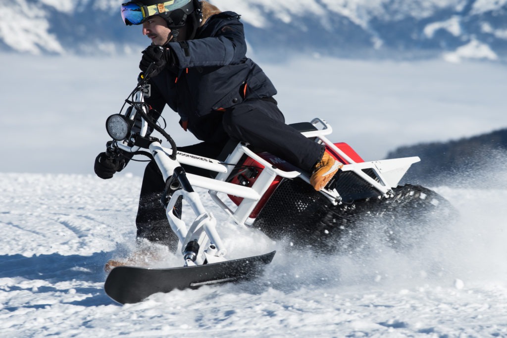 Rider on MoonBike Electric Adventure Motorcycle on the Snow