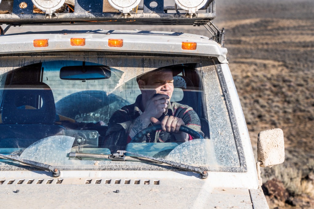 Man sitting in truck on a Midland Radio