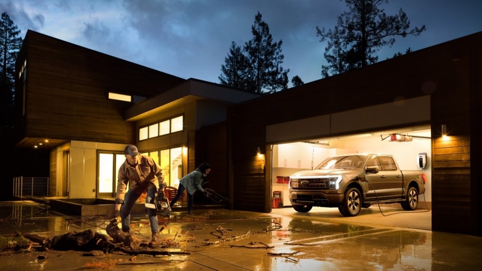 Ford f-50 Lightning powering a house in a storm.