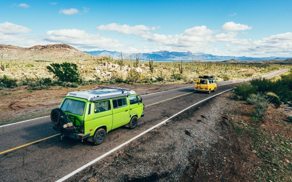 Vanagon VW Volkswagen driving down the paved highway in Baja van life overlanding