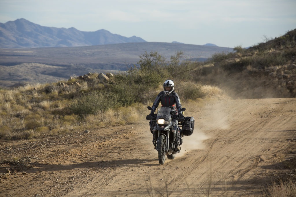 Woman riding motorcycle to crown king senator highway adventure bike arizona