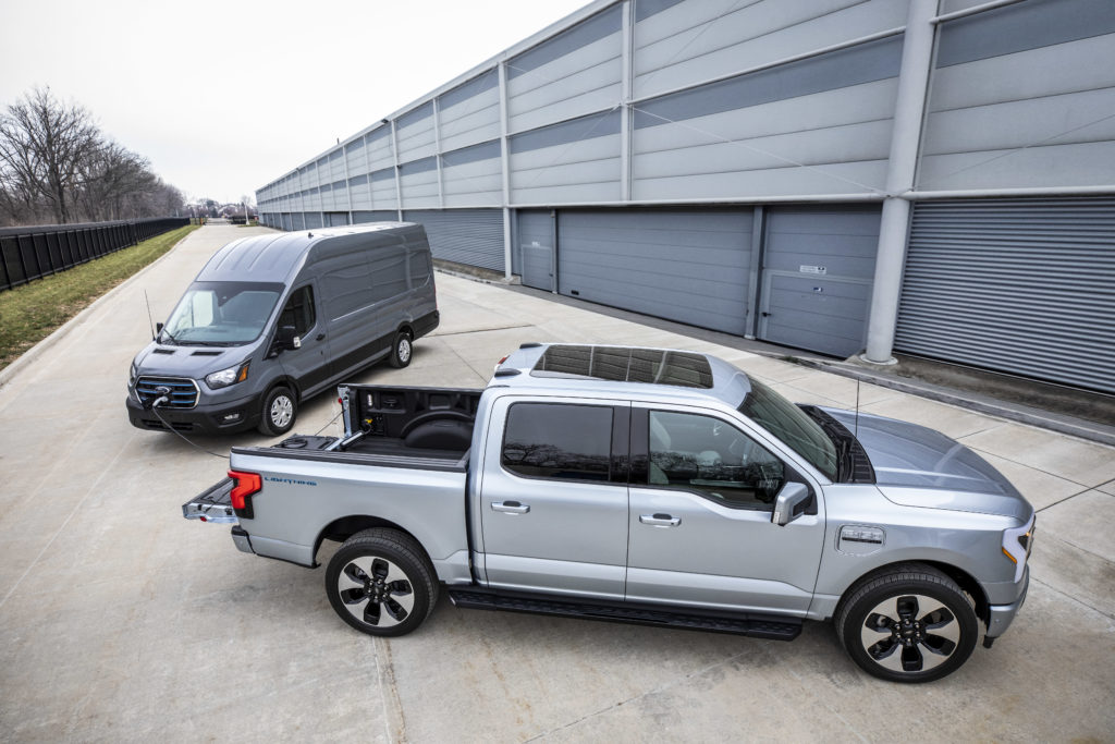 Ford F-150 Lightning charging a Ford e-Transit van.