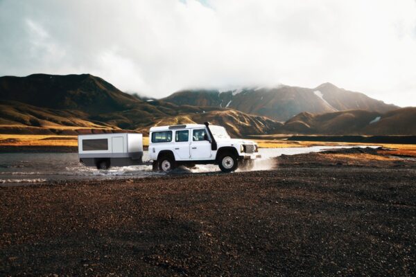 Rendering of ICC Offroad's Offroad Trailer crossing a river.