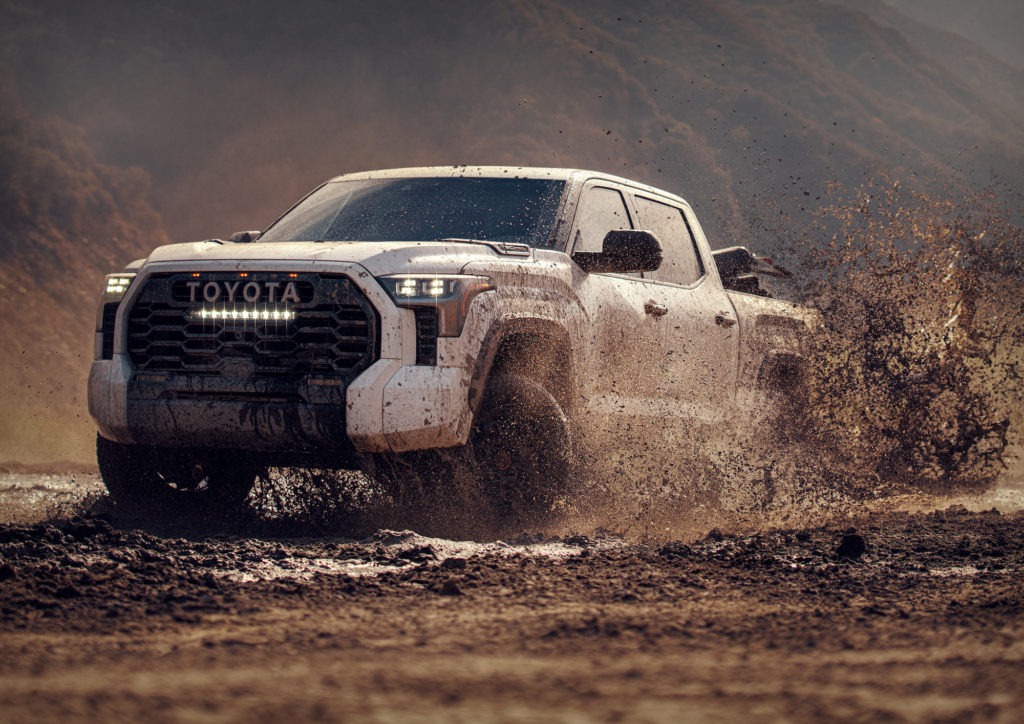 Toyota Tundra splashing in a mud puddle