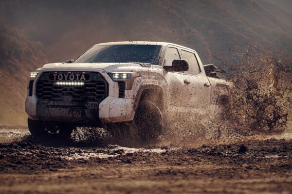 Toyota Tundra splashing in a mud puddle