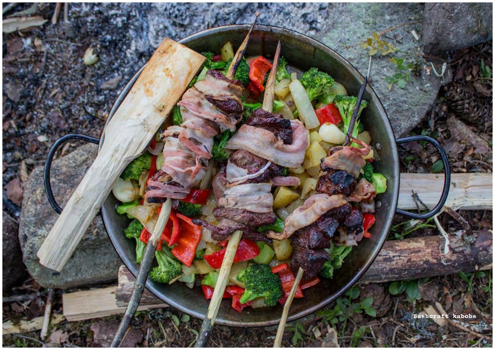 Meat and vegetables prepared to be cooked over an open flame, a braai. 