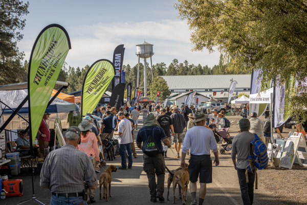 Overland Expo WEST attendees walking through the exhibitor area.