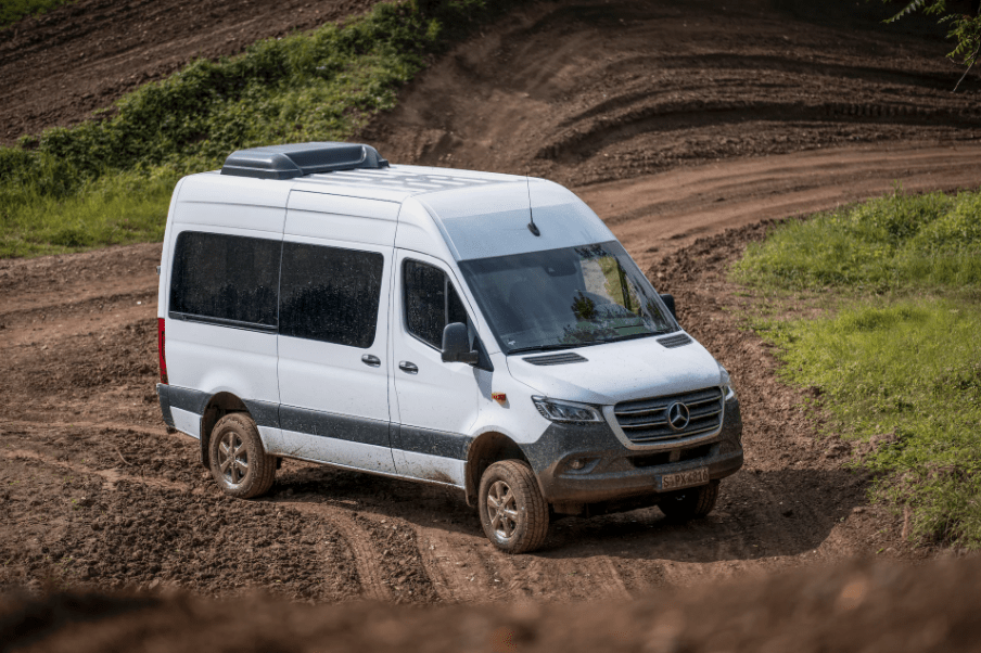 The 2023 Mercedes-Benz Sprinter on a dirt road.