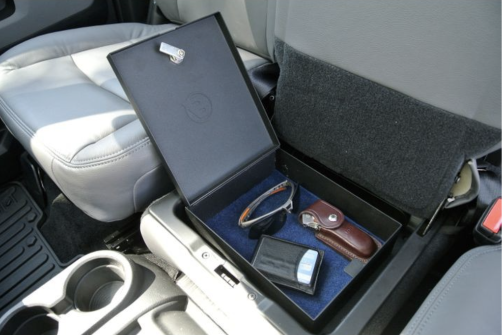 Small items placed in the Universal Storage Lock Box inside a vehicle.