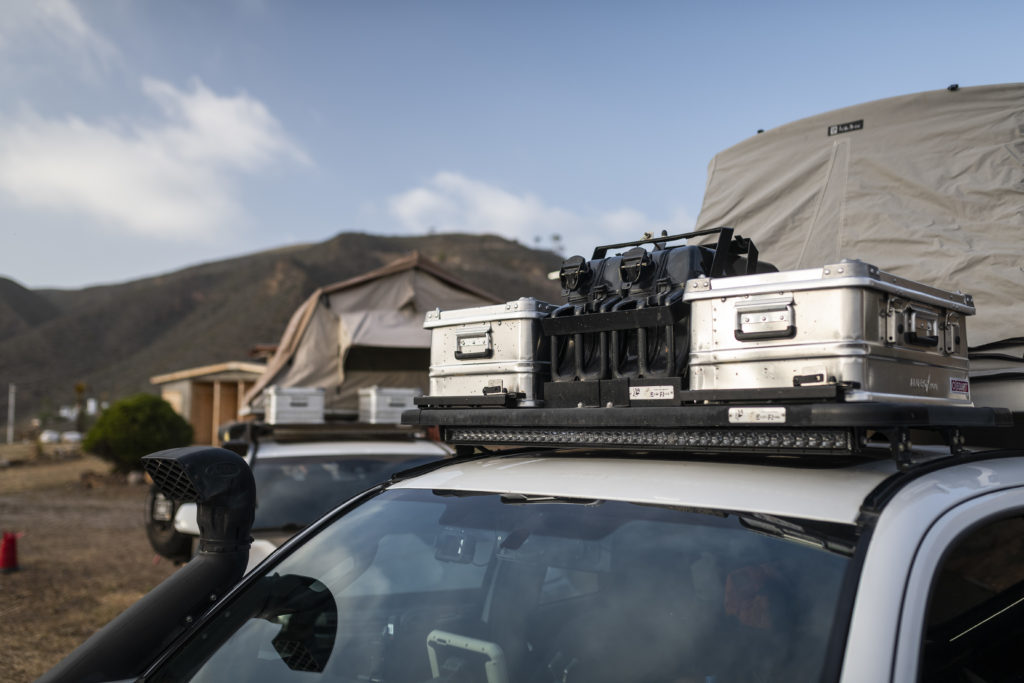 Vehicle with Alubox Storage Cases on roof rack