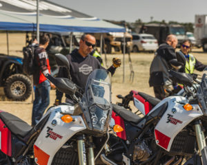 Attendees at Overland Expo with motorcycles