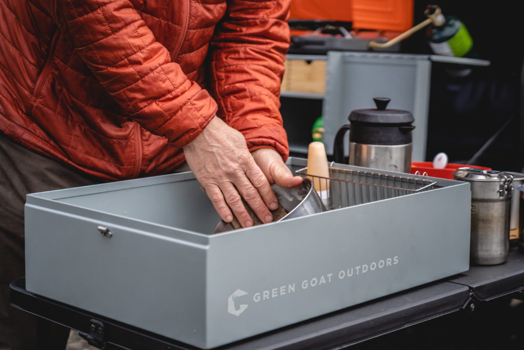 The lid of the Green Goat Outdoors Camp Kitchen becomes the washbasin for dishes.