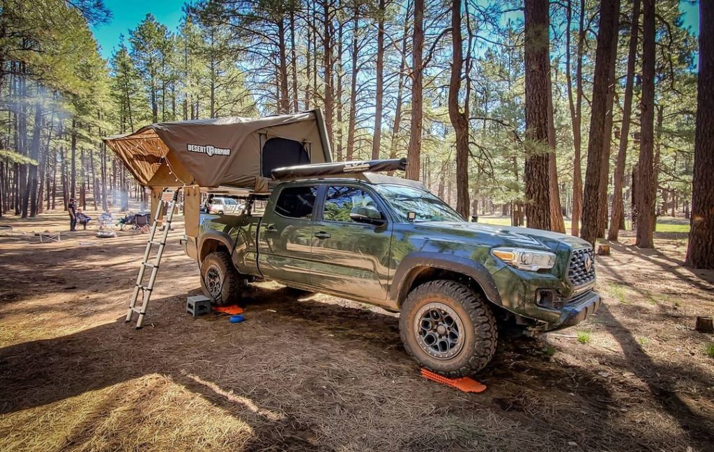 Leveling a Toyota Tacoma at camp using GoTreads XL Traction Boards.