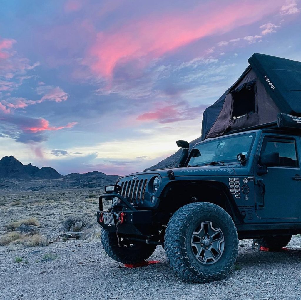 Leveling a Jeep at camp using GoTreads XL traction boards.