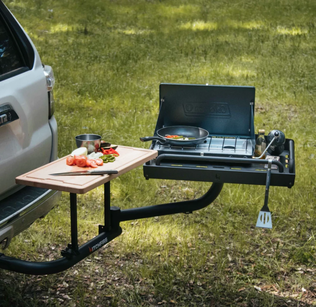 HitchFire's The Ledge is a multi-use hitch-mounted swingout to carry and store camp supplies or to use for cooking.