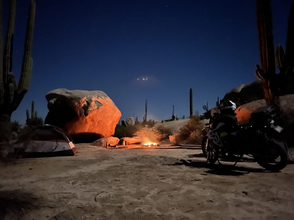 Campfire in the desert on a moto trip.