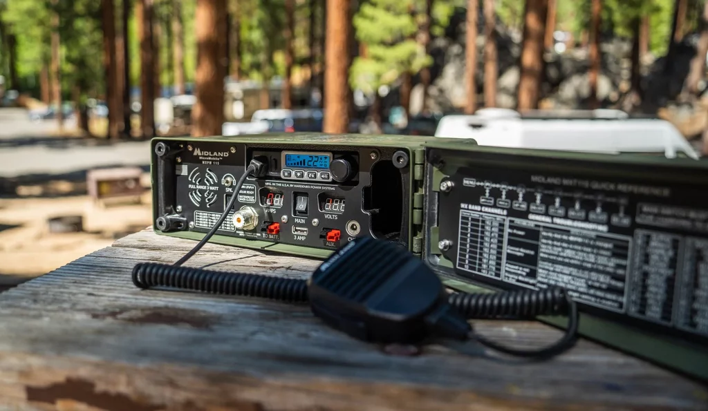 The Midland MXPW115 Ammo Can Base Station set up on a table in the backcountry.