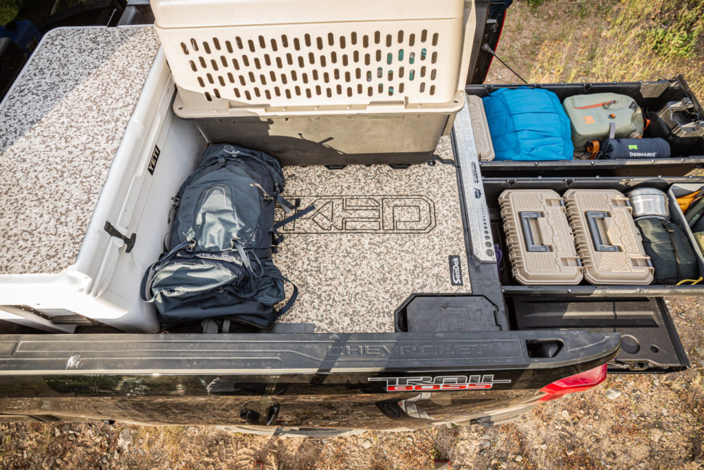 Top view of a loaded truck bed utilizing the DECKED Traction Mat by SeaDek.