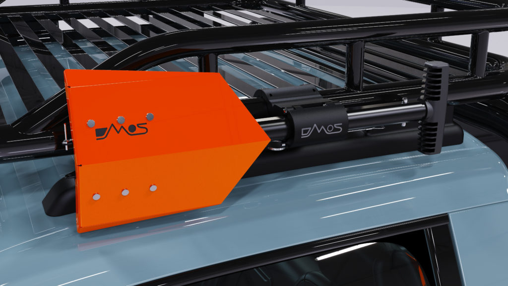 DMOS Compact Delta Shovel Mounted to a vehicle roof rack.