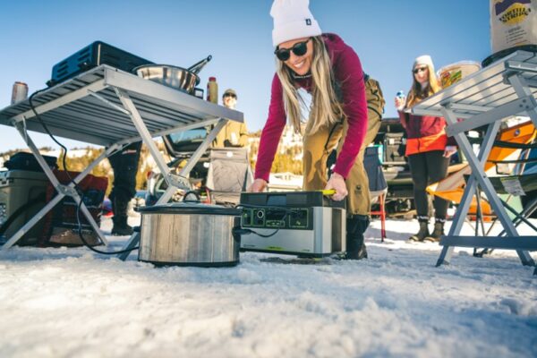 Woman powering camp with the Goal Zero Yeti Lithium 1500X Portable Power Station