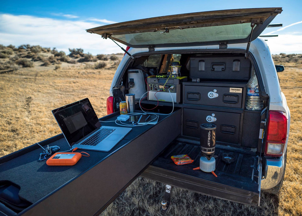 Powering devices on the back of a truck using a portable power solar base station.