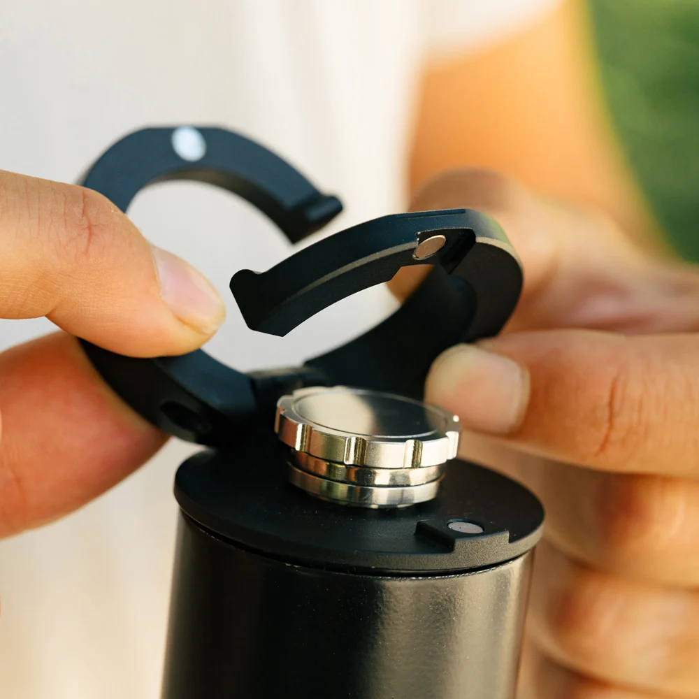 Photo of the VSSL Insulated Flask with Bluetooth Speaker featuring a pop-up drinking cap / carabiner