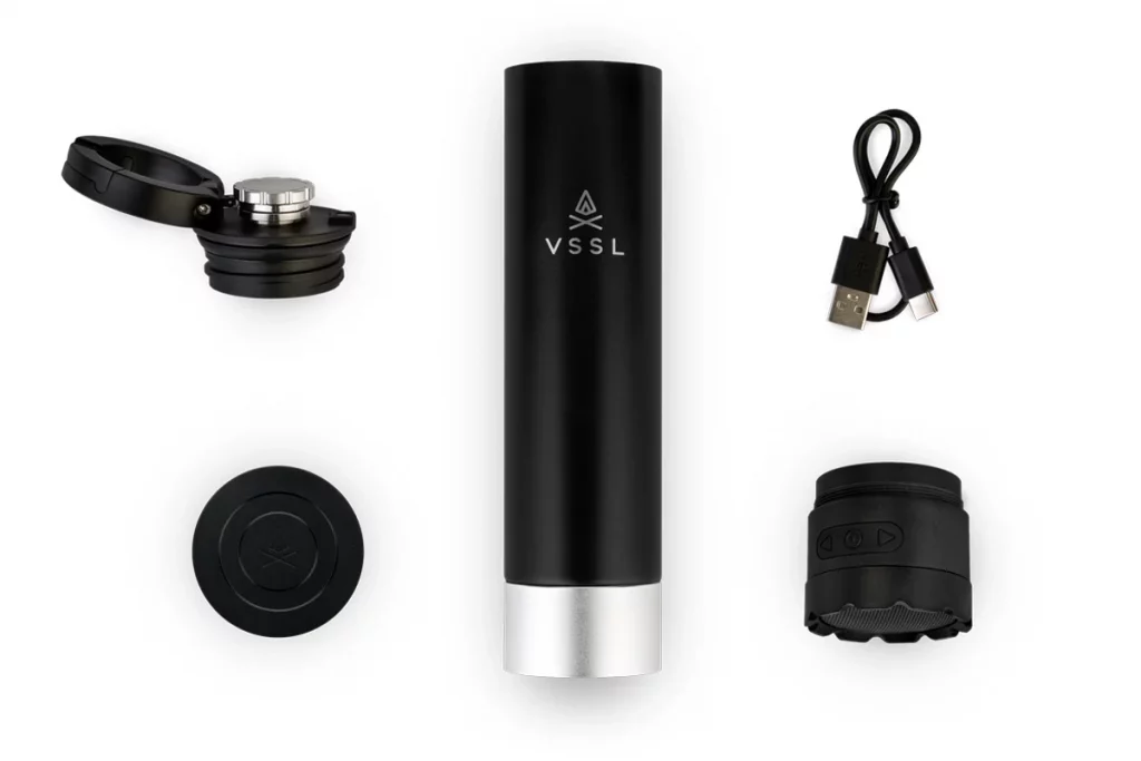 The VSSL Insulated Flask includes the flask, drinking cap/ carabiner, Bluetooth speaker, recharging cable and flat end cap.