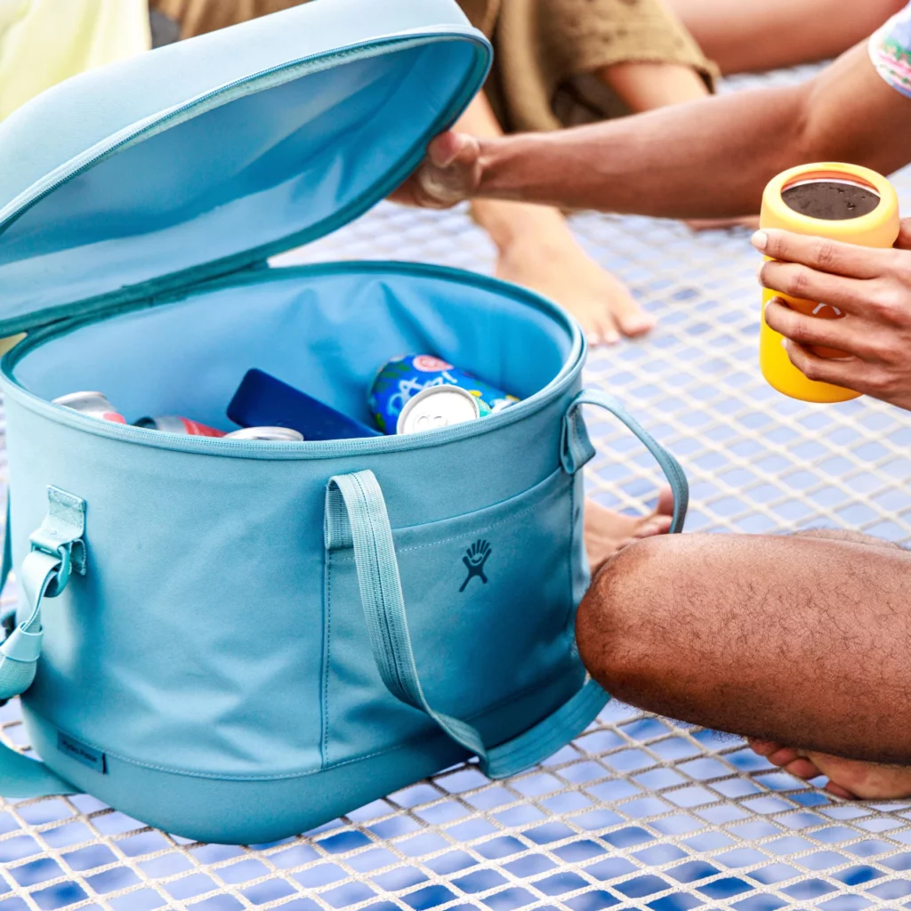 Hydro Flask 12L Carryout Soft Cooler at a picnic.