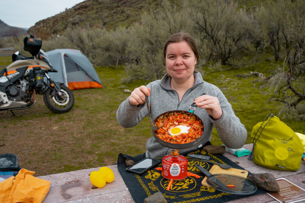 Amanda Zito cooking in camp.